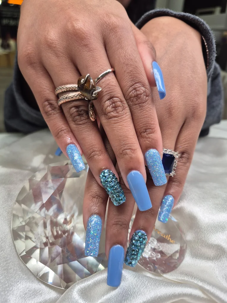 Sky Blue Glitter nail design by Zuzu Nails & Beauty in Jacksonville, Florida