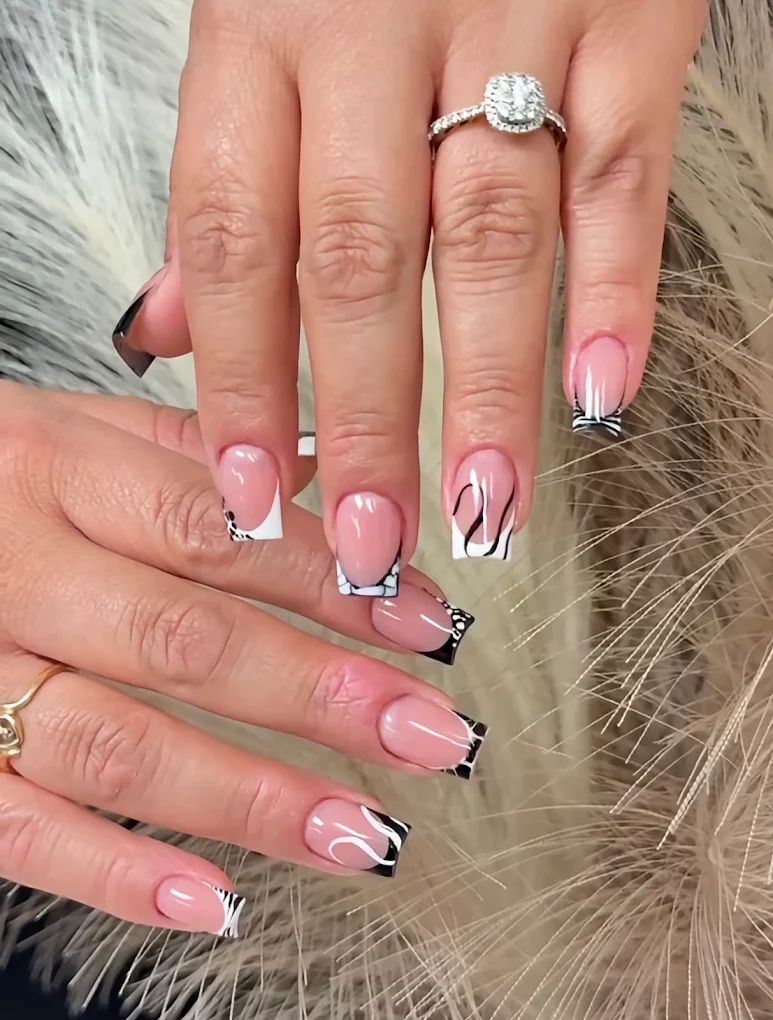 Abstract Zebra French nail design by Zuzu Nails & Beauty in Jacksonville, Florida